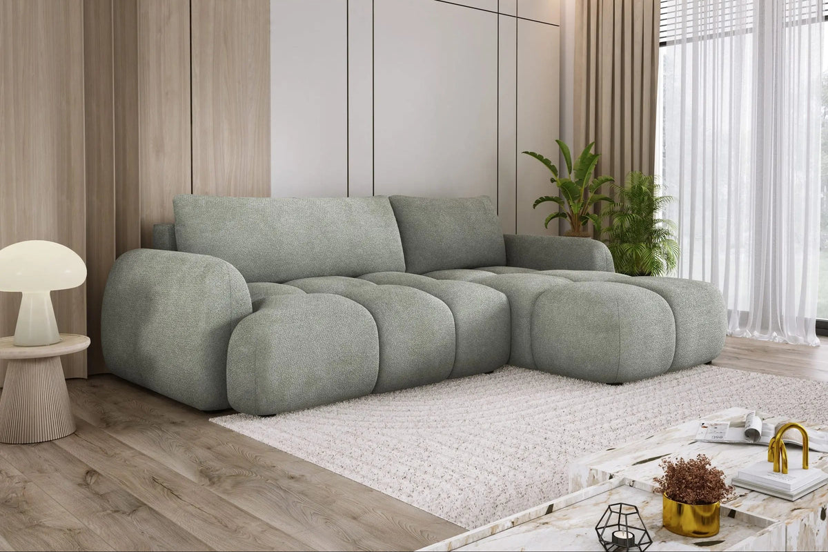 Canapé d'angle convertible GLYCINE S en tissu bouclé vert d'eau installé dans un salon lumineux