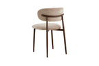 Chaise de salle à manger NONYA en tissu beige, piètement métal effet bois — en situation