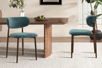 Chaise de salle à manger NONYA en tissu bleu-vert, piètement métal effet bois