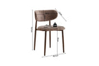 Chaise de salle à manger NONYA en tissu sable, piètement métal effet bois — en situation