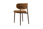 Chaise de salle à manger NONYA en tissu marron clair, piètement métal effet bois — en situation