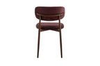 Chaise de salle à manger NONYA en tissu mauve foncé, piètement métal effet bois — en situation