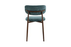 Chaise de salle à manger NONYA en tissu bleu-vert, piètement métal effet bois — en situation